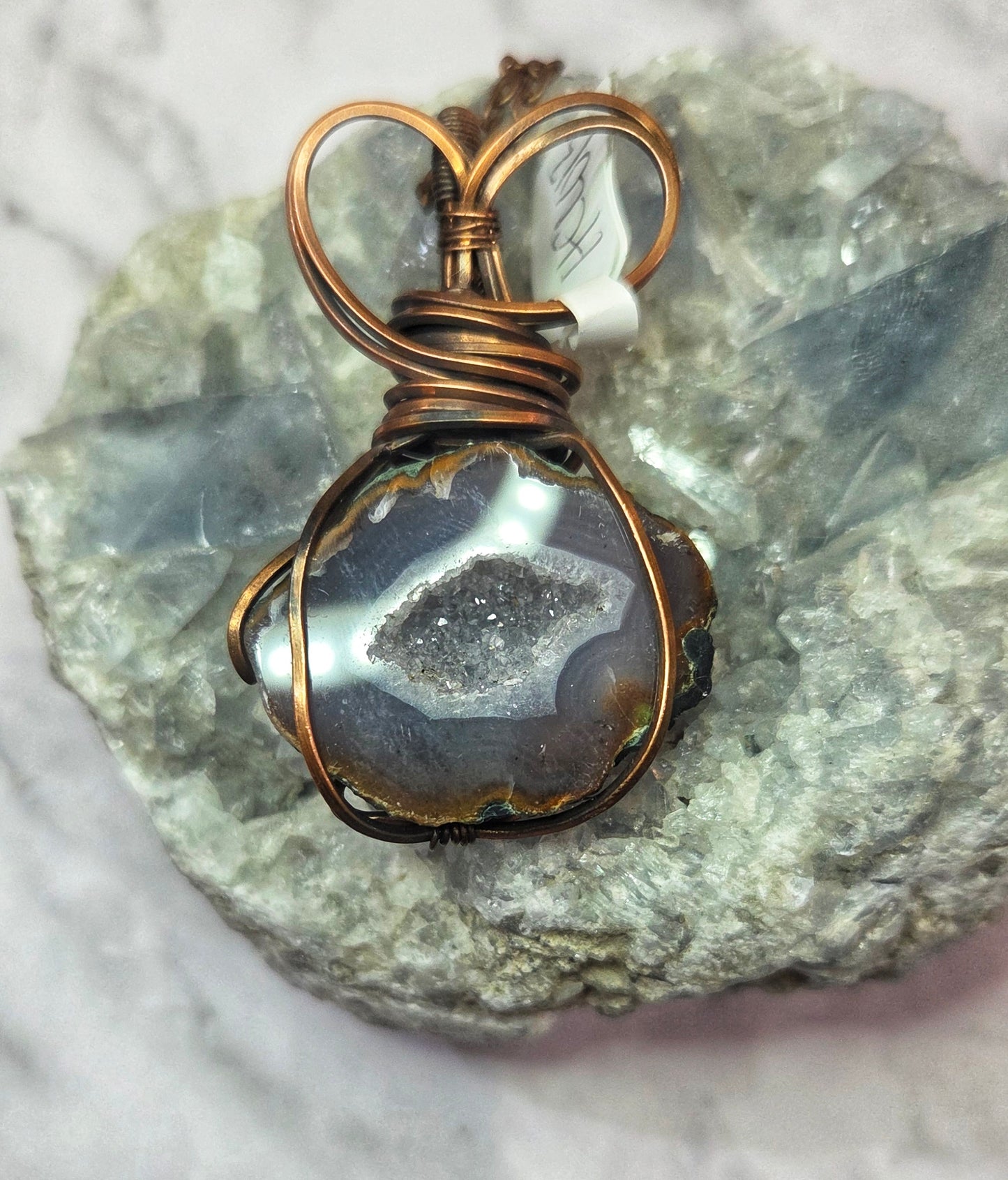 Geode wrapped in aged copper