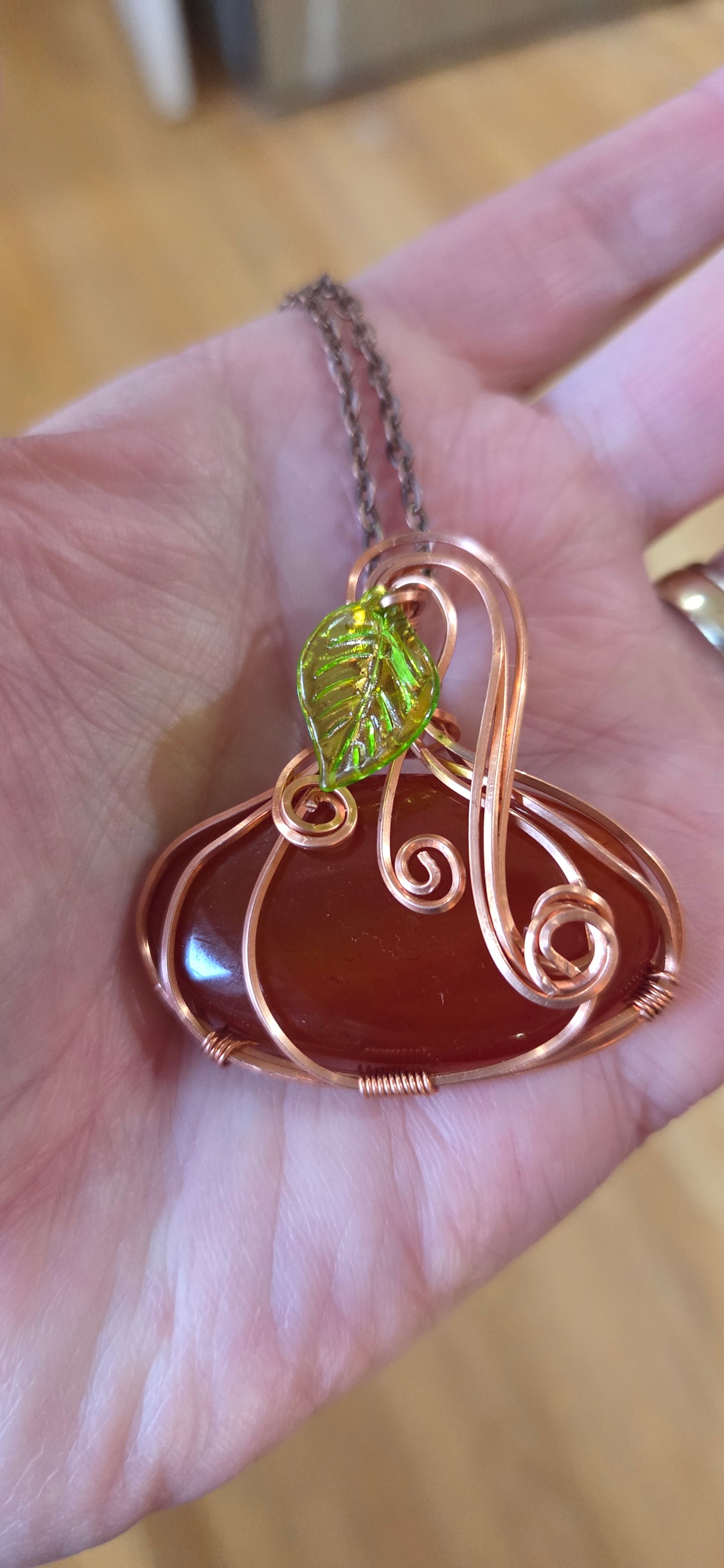 Carnelian Pumpkin pendant wrapped in copper