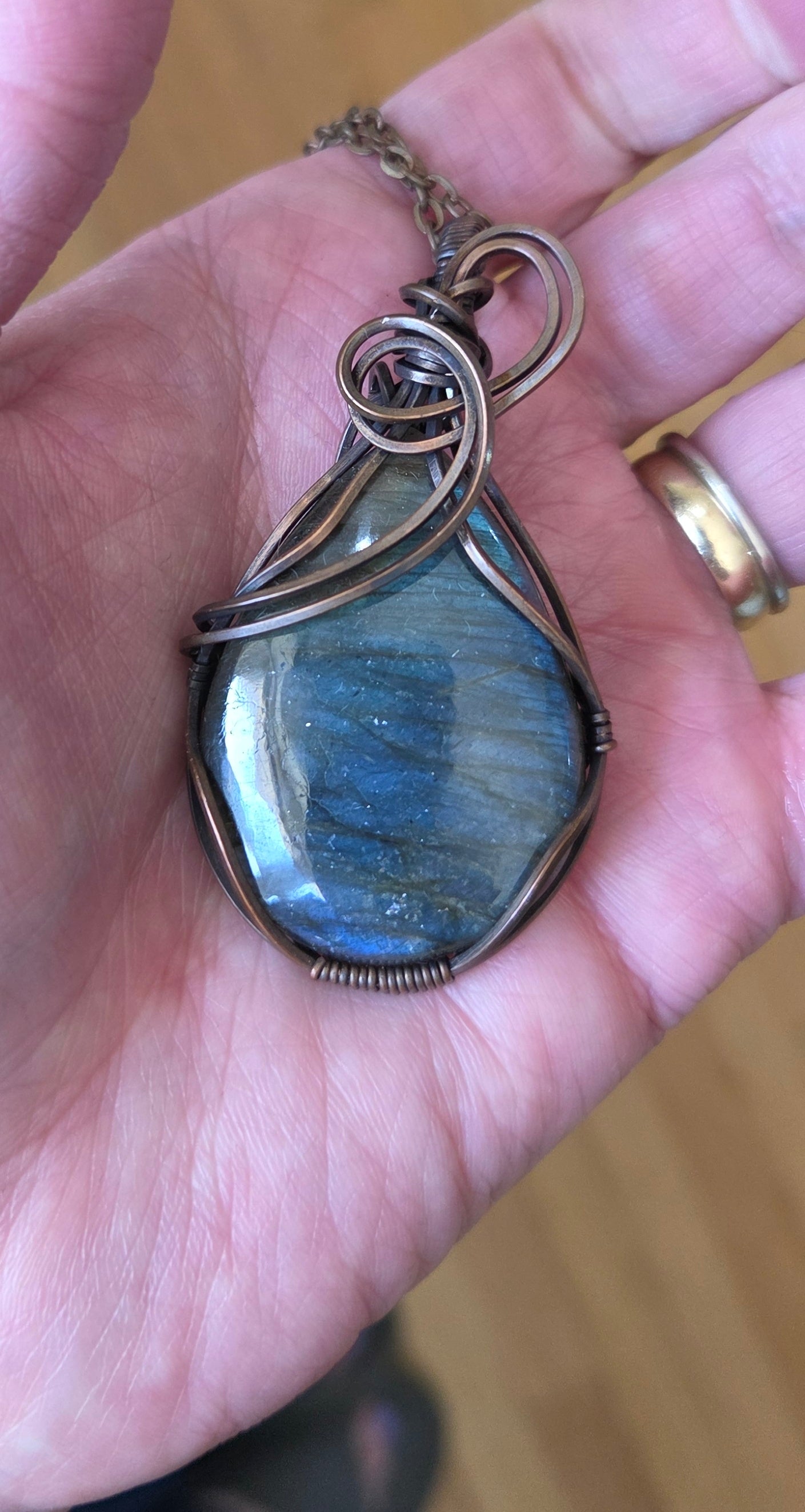 Labradorite wrapped in aged copper