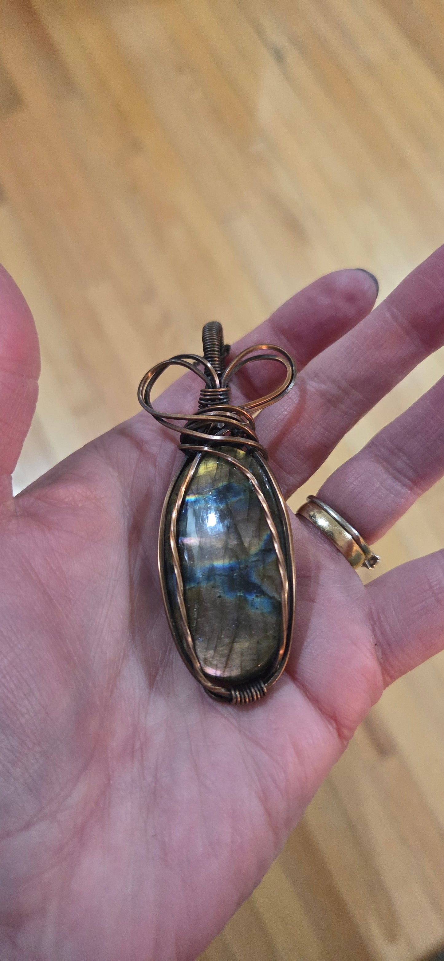 Labradorite wrapped in aged copper