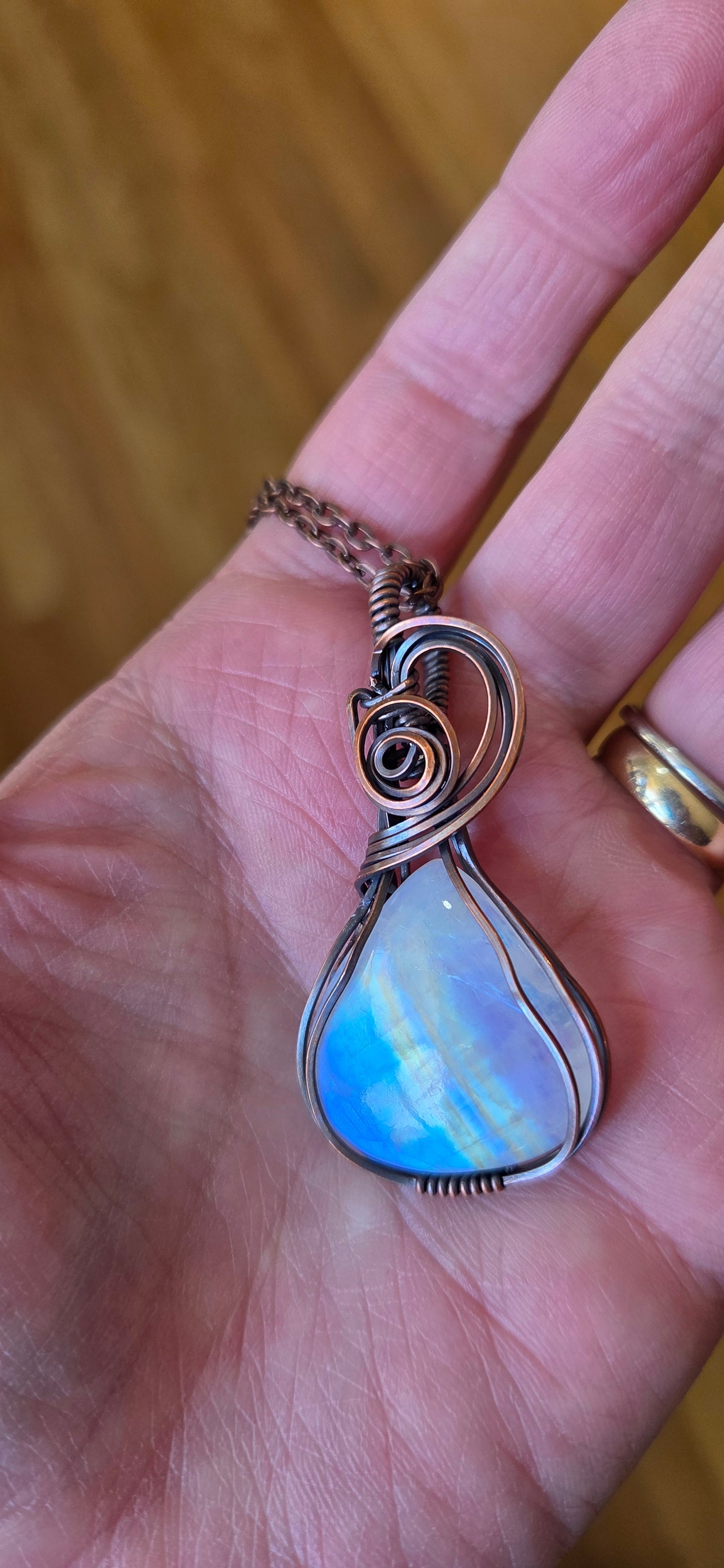 Moonstone wrapped pendant wrapped in copper.