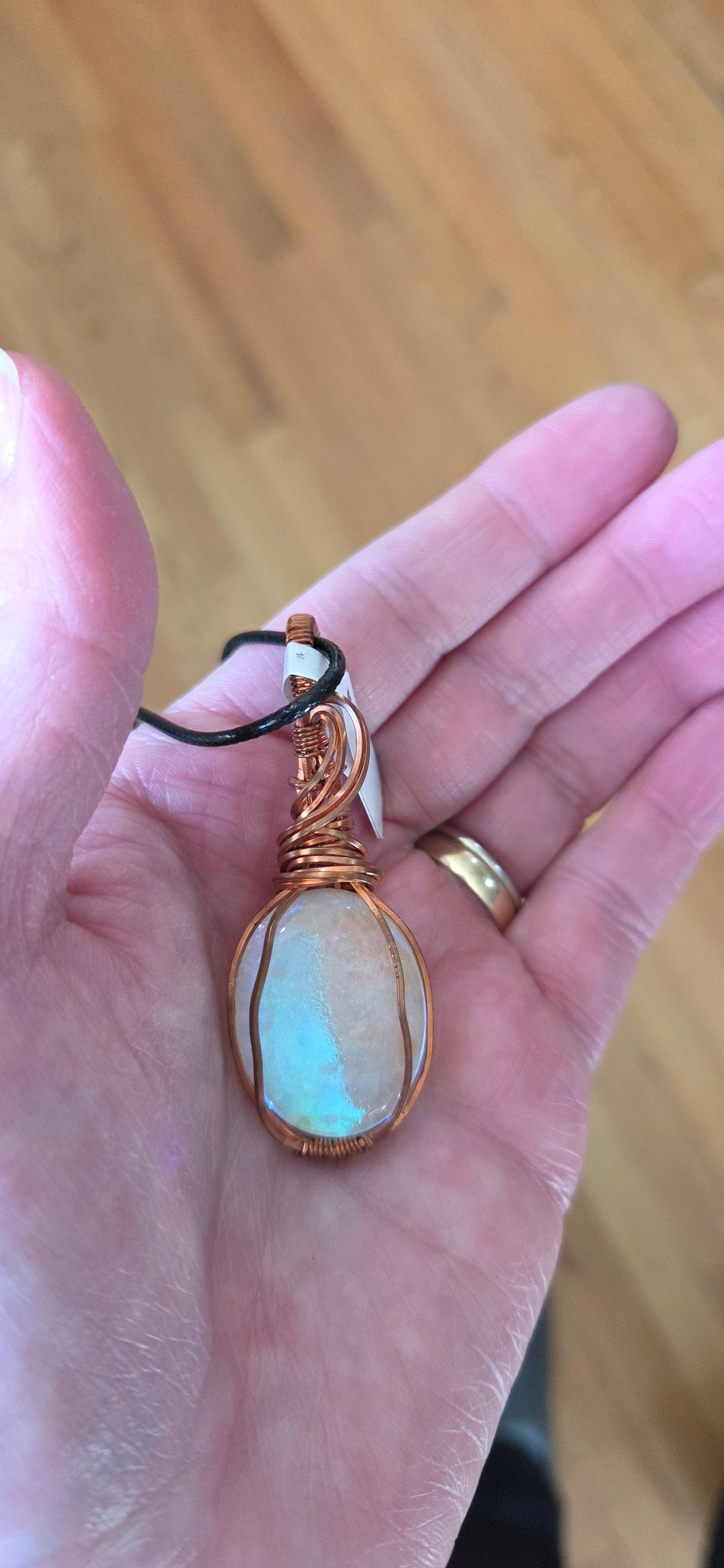 Moonstone Doublet-wrapped in copper-comes on a black cord