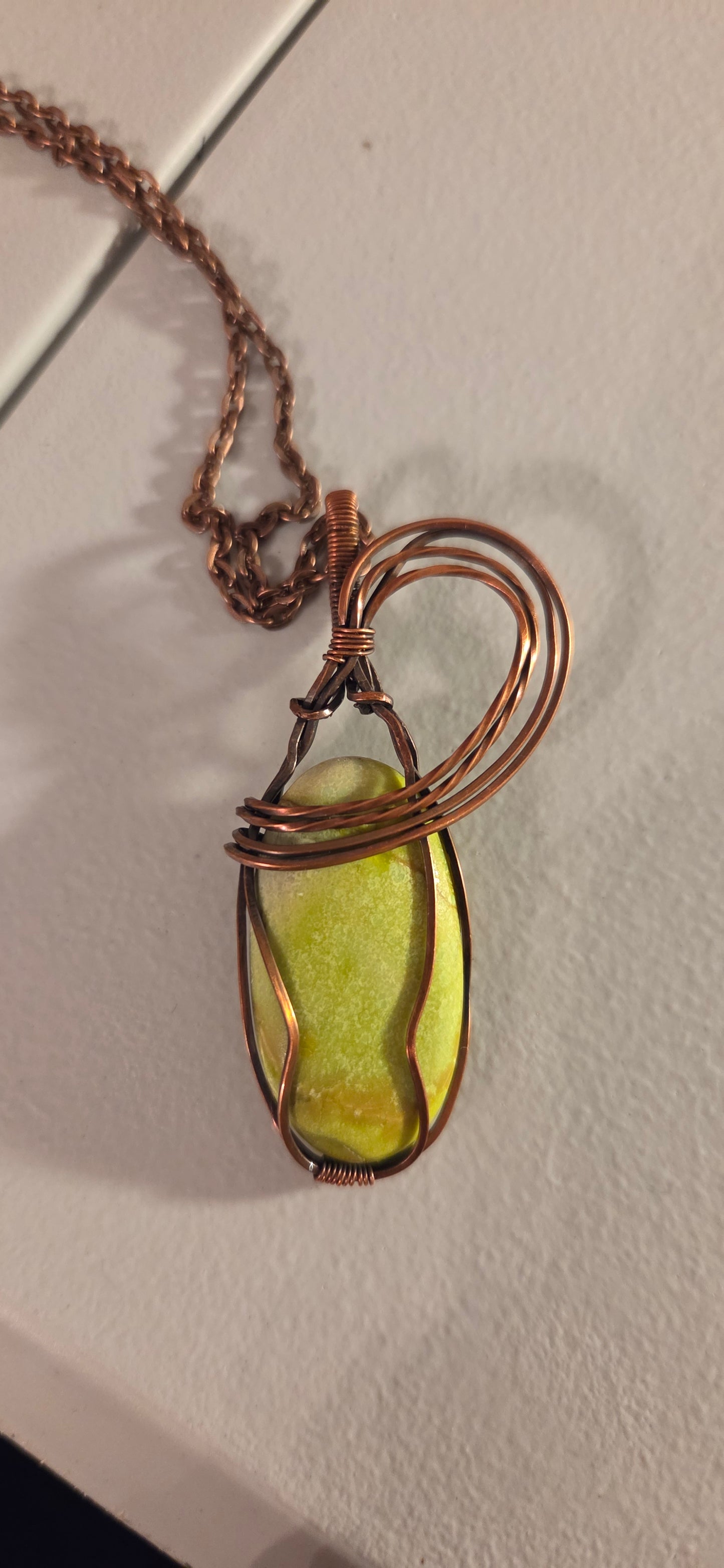 Gaspeite wrapped in copper pendant