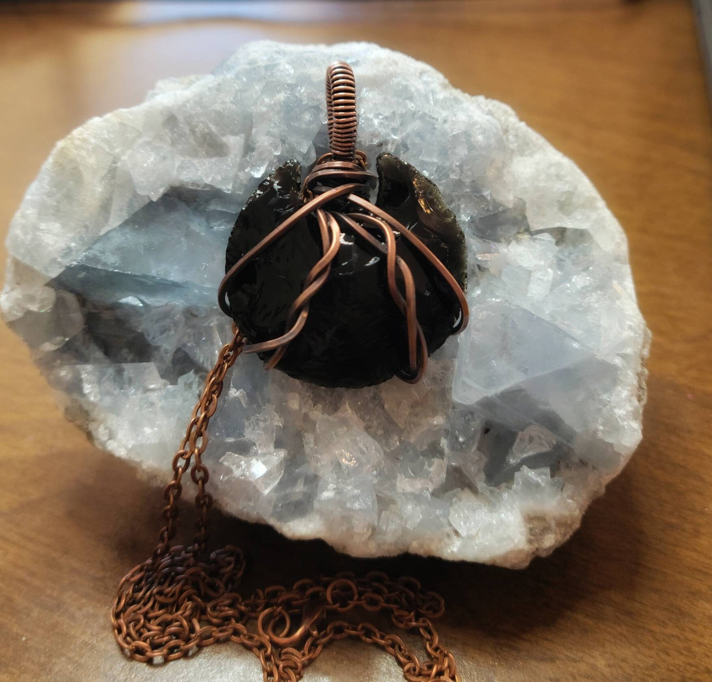 Obsidian moon wrapped in copper