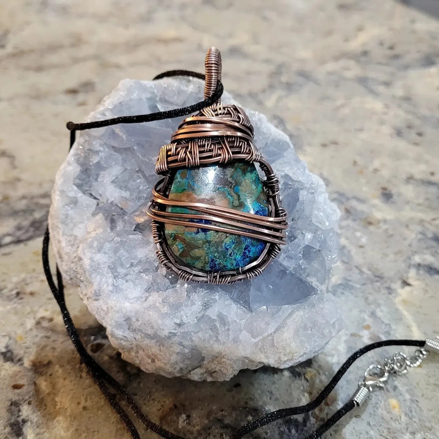 Chrysocolla wrapped in aged copper