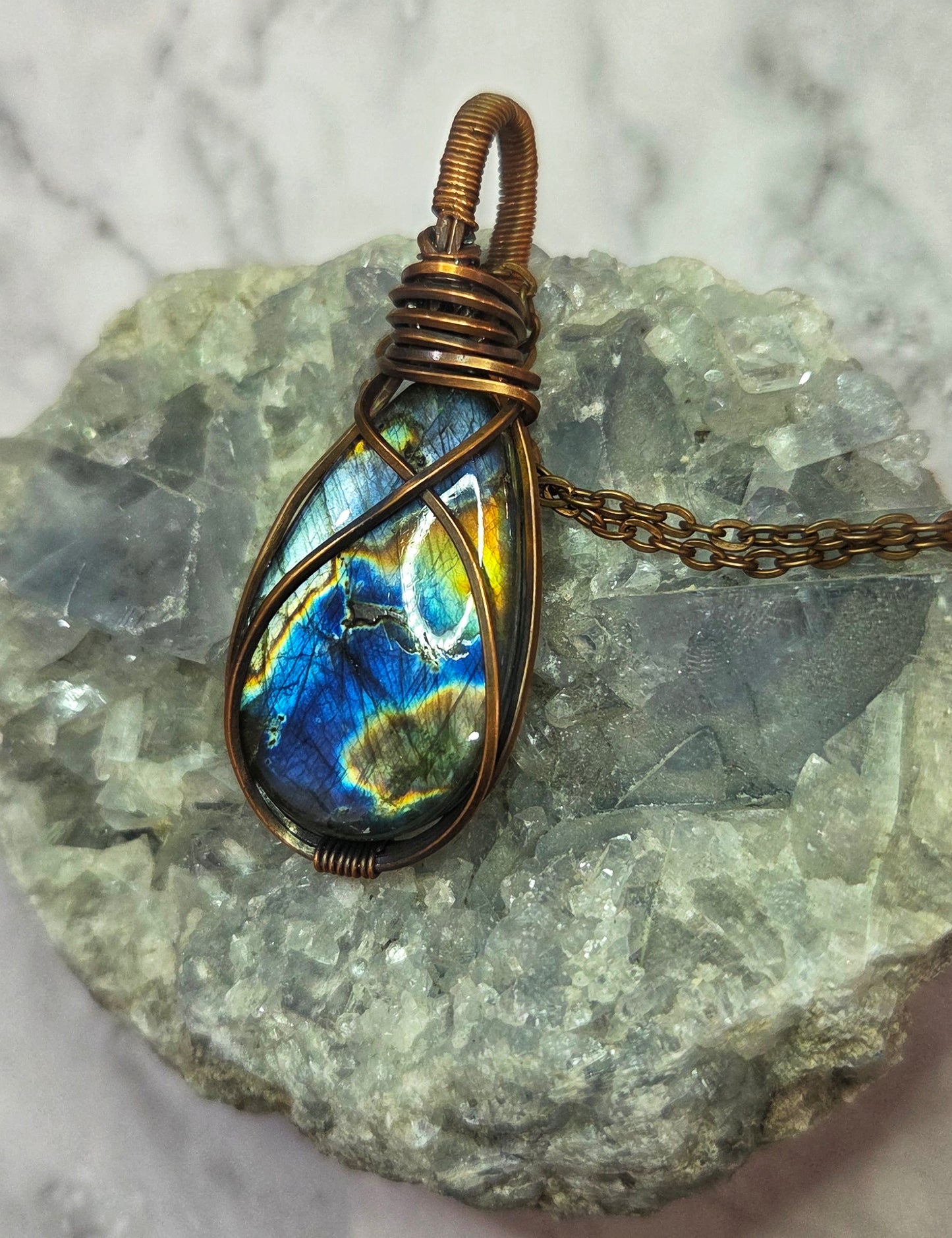 Spectrolite wrapped in aged copper