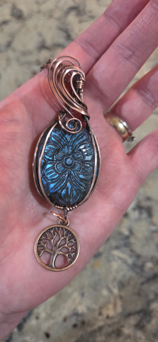 Carved blue labradorite wrapped in aged copper with a copper tree of life charm and starter chain.