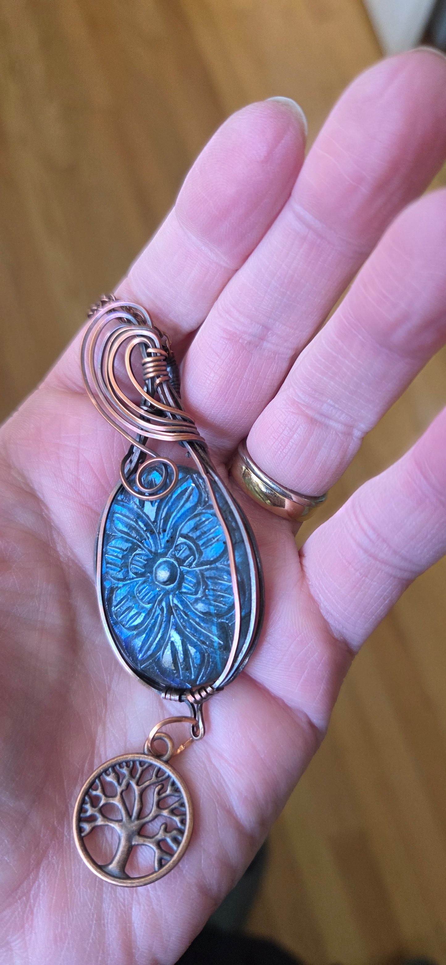 Carved blue labradorite wrapped in aged copper with a copper tree of life charm and starter chain.