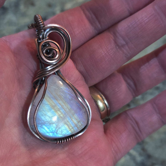 Moonstone wrapped pendant wrapped in copper.