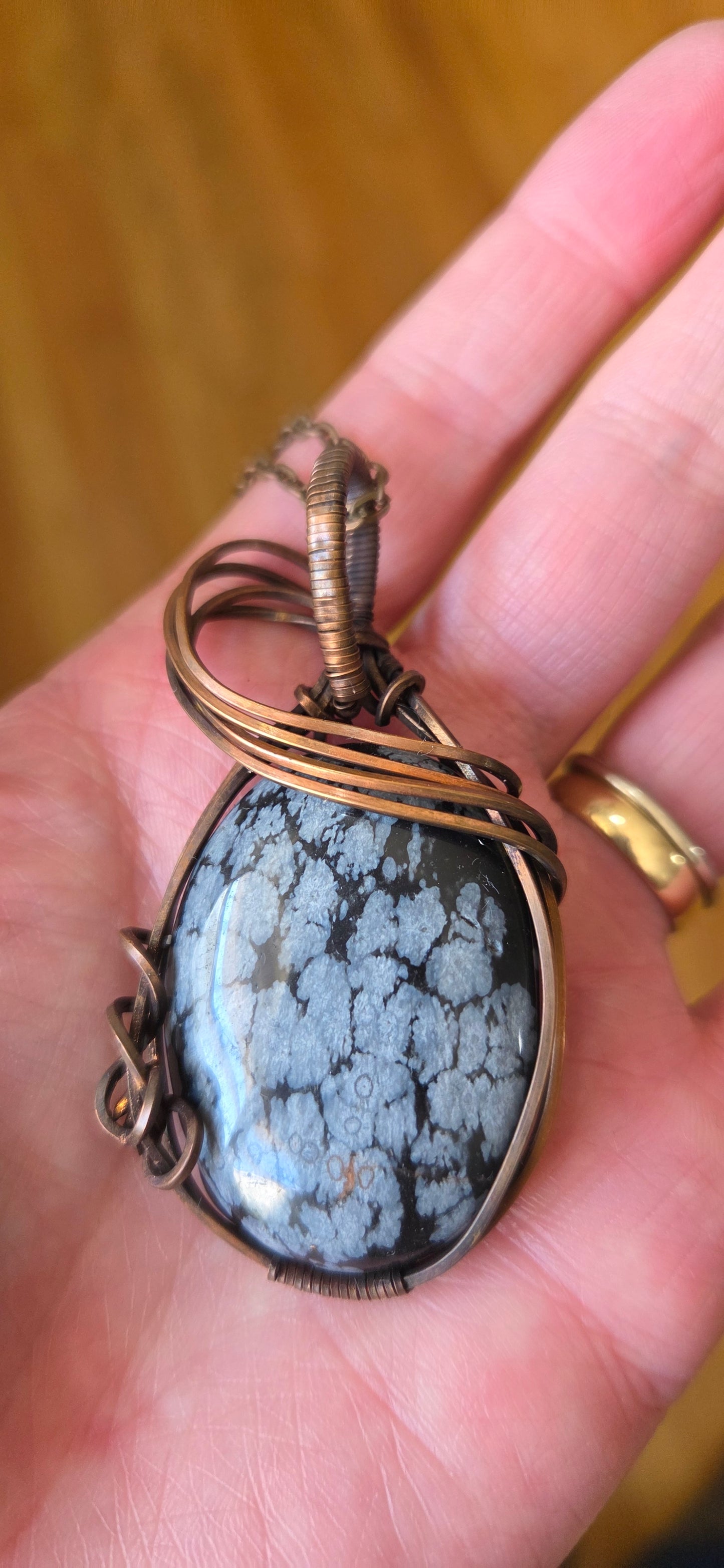 Snowflake Obsidian wrapped in aged copper