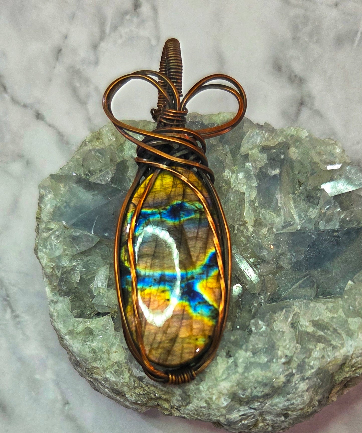 Labradorite wrapped in aged copper