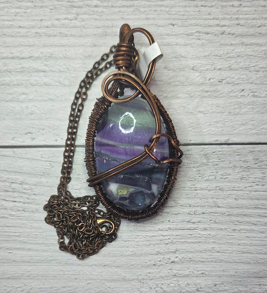 Fluorite wrapped in aged copper