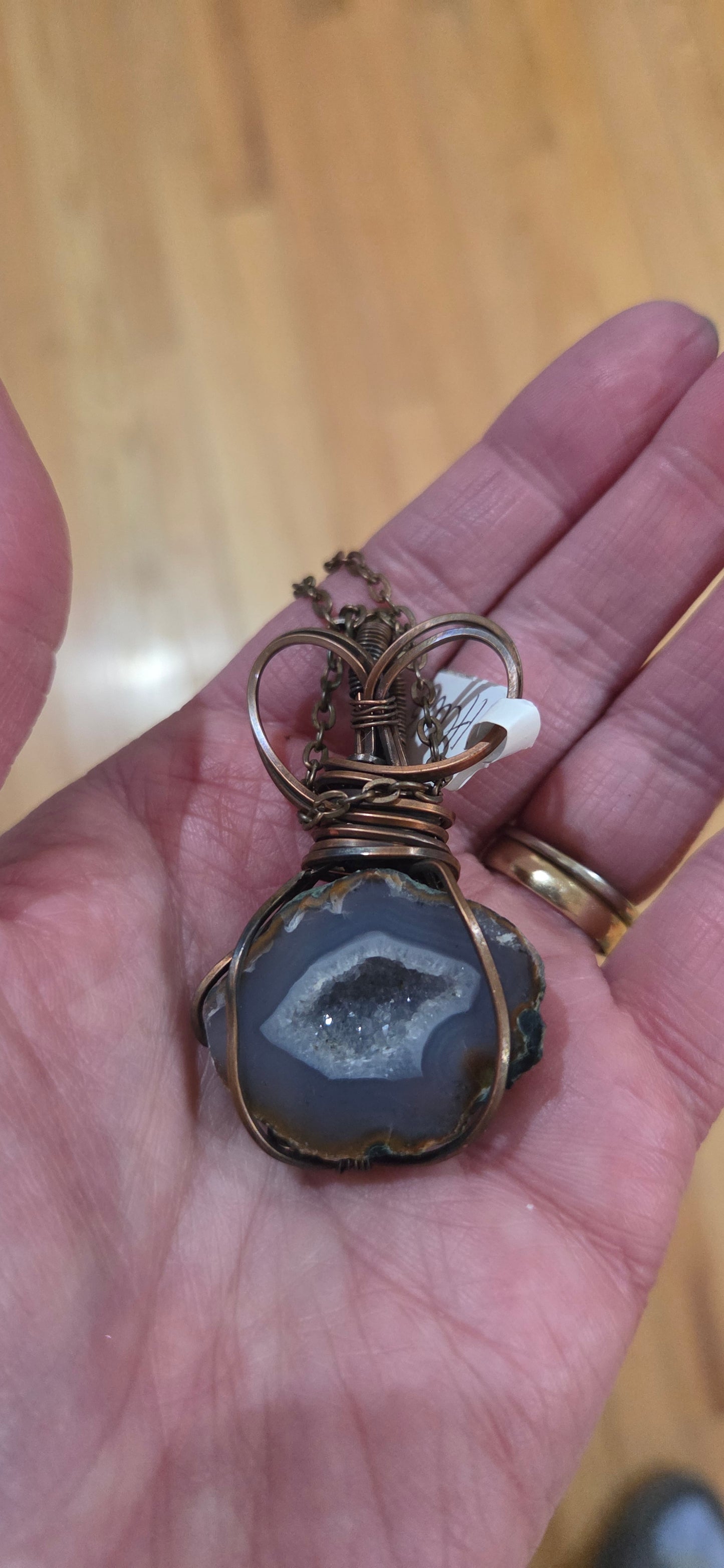 Geode wrapped in aged copper